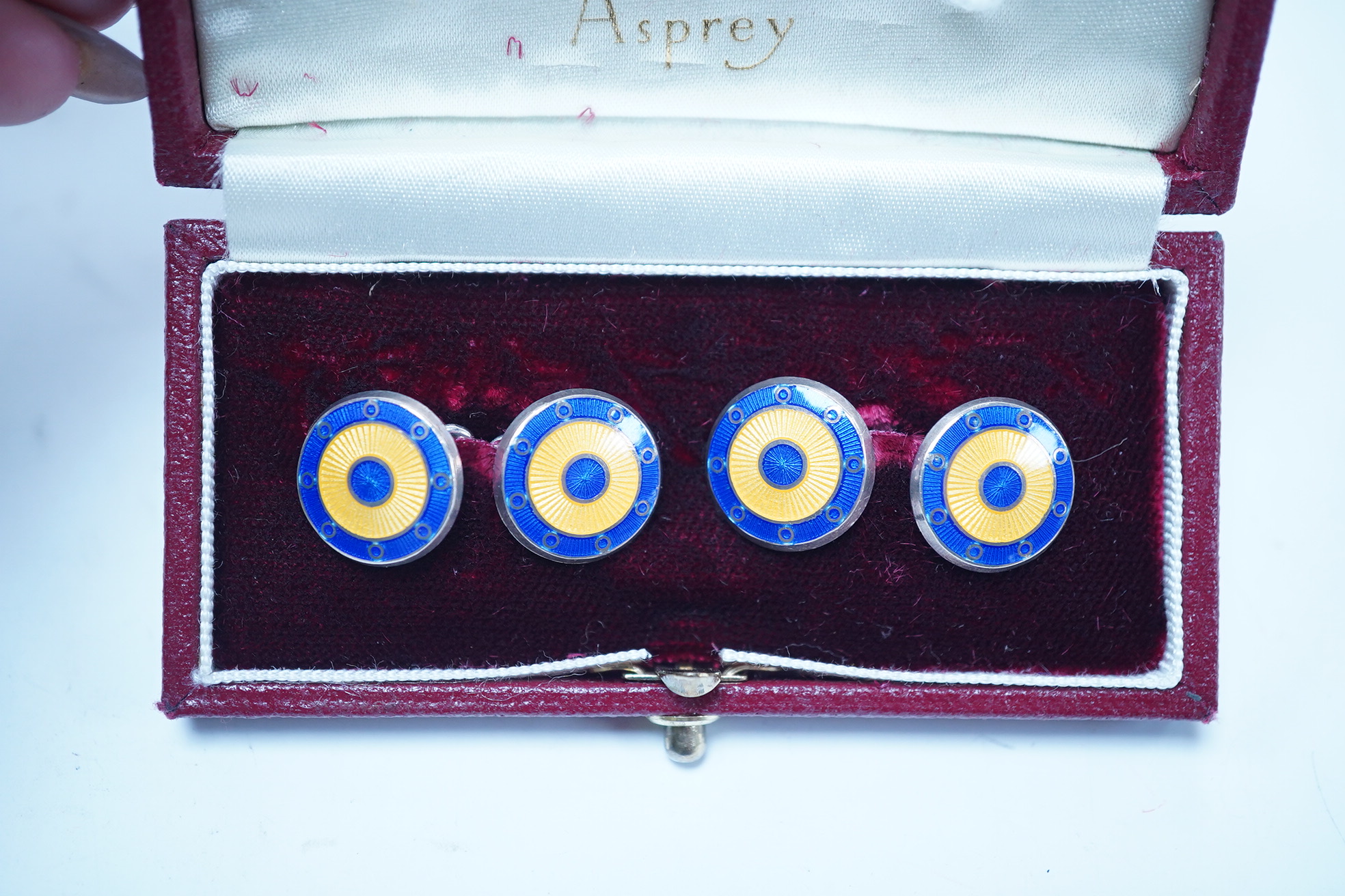 A modern pair of Asprey silver and two colour enamel set target disc cufflinks, in original Asprey box, 14mm. Condition - fair to good